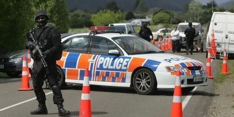 Armed police check vehicles at a roadblock in the Ruatoki Valley during the 2007 Operation eight raids. — Photo: Alan Gibson.