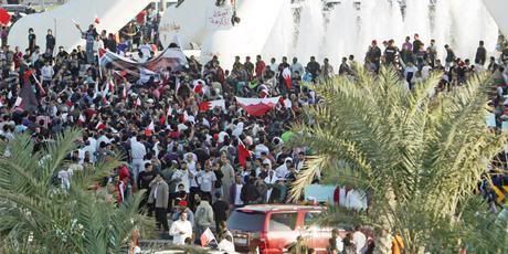 Demonstrators gather around the Pearl Monument in the main square of  Manama, Bahrain.  Photo: Associated Press.