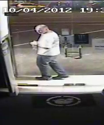 ACID ATTACK: CCTV footage of B Jammin owner Rick Powell spraying acid through the door of Taupo clothing shop Addiction.