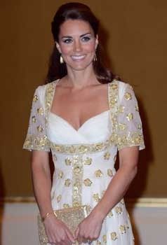 OCCUPATIONAL HAZARD: The Duchess of Cambridge on a visit to Malaysia. She often has to wear posh evening frocks with low decolletage and needs an all-over tan to peep through the shoestring straps.  Photo: Getty Images.