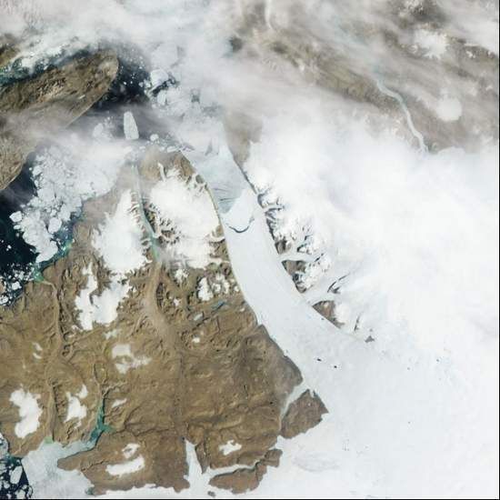 This satellite image from Monday shows a calving, crescent-shaped crack on the Petermann Glacier in northwestern Greenland.  NASA/Associated Press.