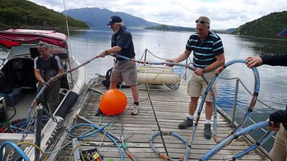Scientists prepare the seismic reflection gear before heading out to survey the lake floor of Lake Rotomahana, southeast of Rotorua.  Photo: Julian Thomson.