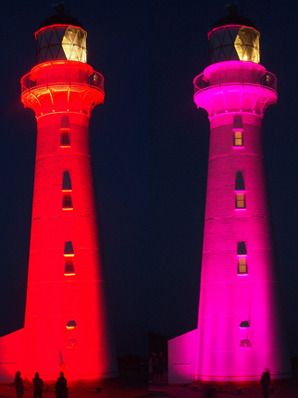 COLOURFUL: It was a light show like no other having Castlepoint Lighthouse lit up an array of colours to mark its centenary.  Photo: PETE NIKOLAISON.