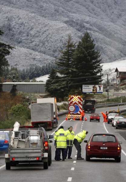 ROAD TO NOWHERE: Police turn drivers around at the base of the Rimutakas after snow forced its closure. — KENT BLECHYNDEN/Fairfax NZ.