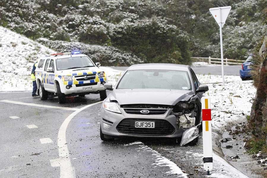 COLD COMFORT: This car was damaged when it slid in the snow on the Rimutaka Hill road. — KENT BLECHYNDEN/Fairfax NZ.
