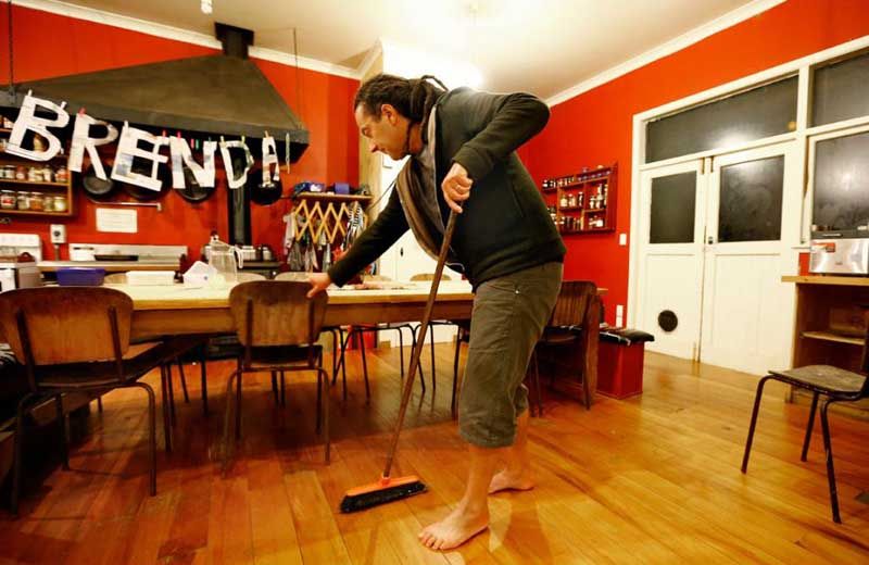 Justin helps with the after-dinner cleanup. — PHIL REID/Fairfax NZ.