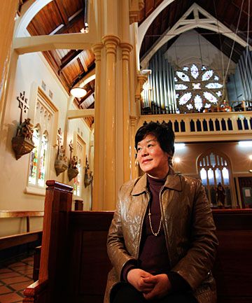 FAREWELL FOR NOW: Parishioner Cecilia Kim looks around the church for the last time before it is closed for earthquake strengthening.