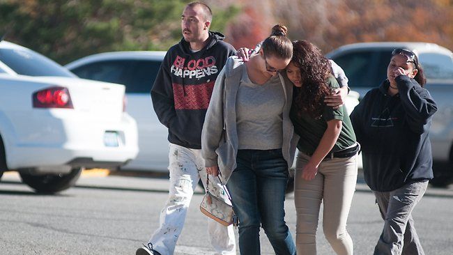 A Sparks Middle School student and her mother walk near Agnes Risley Elementary School, after students were evacuated to the school after a shooting at Sparks Middle School.  Photo: Associated Press.