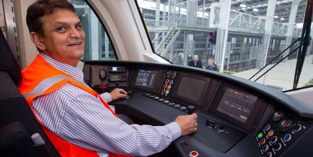 Driver William Els tries out the console of the new electric trains.  Photo: Richard Robinson.