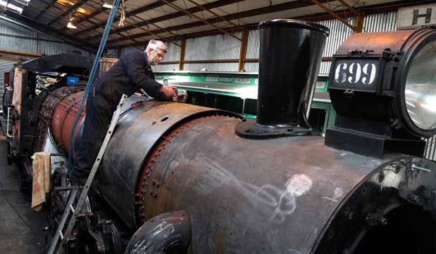 WORK UNDER WAY: Dowell McLeod, of Christchurch, works on the Ab699 steam locomotive at the Pleasant Point Museum and Railway.  MYTCHALL BRANSGROVE/Fairfax NZ.