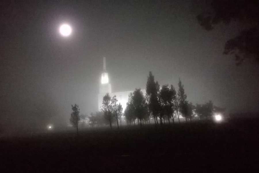 After driving through very heavy fog this glow appeared on the side of the road in Hamilton — it was the moon and itextended in to this spooky view of the temple. — Photo: Tisza Sargeant.