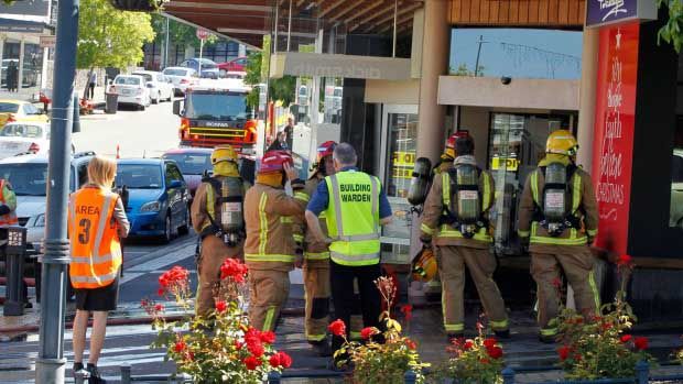 Firefighters at the scene of the window-display fire at Ballantynes' Timaru store this afternoon.  MYTCHALL BRANSGROVE/Fairfax Media.