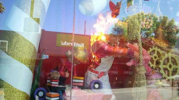 A figure in Timaru's Ballantynes Christmas window display goes up in flames.  JANE RIDDLE/ Facebook.