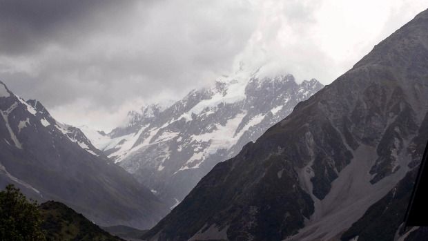 Aoraki/Mount Cook was covered in cloud at 4pm yesterday, hampering the search for three missing climbers.  Photo: John Cosgrove.