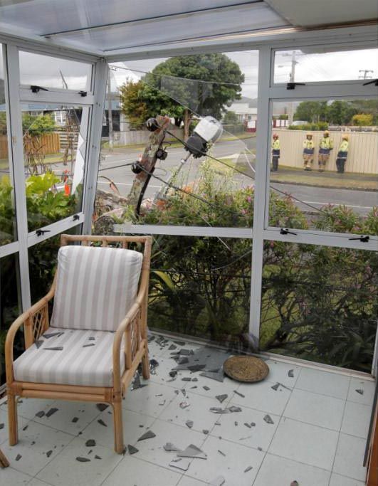 Inside Ken Oliver's conservatory after a lamp-post fell through it.  KENT BLECHYNDEN/Fairfax NZ.