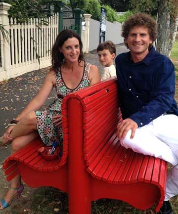 BENCH BREAK: Helen, left, Marco and Ralf Schnabel take a rest on the Curran Street loveseat.
