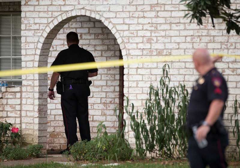 Law enforcement officers investigate the scene of a shooting Wednesday, July 9th, 2014, in Spring. Seven people were shot, with six confirmed dead. — Photo: Brett Coomer/Houston Chronicle.