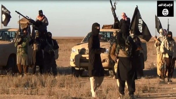 An image taken from a propaganda video uploaded by jihadist group the Islamic State of Iraq and the Levant (ISIL) allegedly shows ISIL militants gathering at an undisclosed location in Iraq’s Nineveh province. Militants took control of the Iraqi city of Tikrit and freed hundreds of prisoners today, police said, the second provincial capital to fall in two days. — Photo: AFP/Getty Images.
