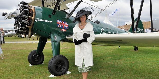 GLAMOUR: A visitor to an airshow in Goodwood UK, dressed up in period costume.