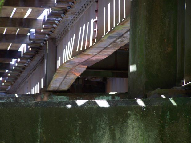 BENT: The underside of the damaged rail bridge span.