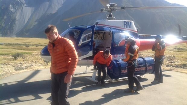 Three climbers arrive at Mount Cook Airport after being airlifted to safety in the Aoraki/Mount Cook area.