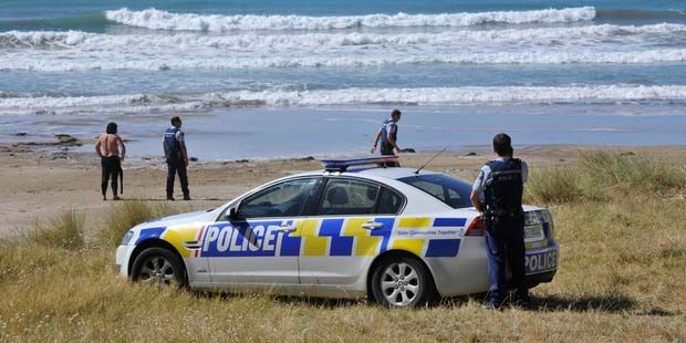Police at Makorori Beach, where one man was found dead and another is missing.  Photo: The Gisborne Herald.