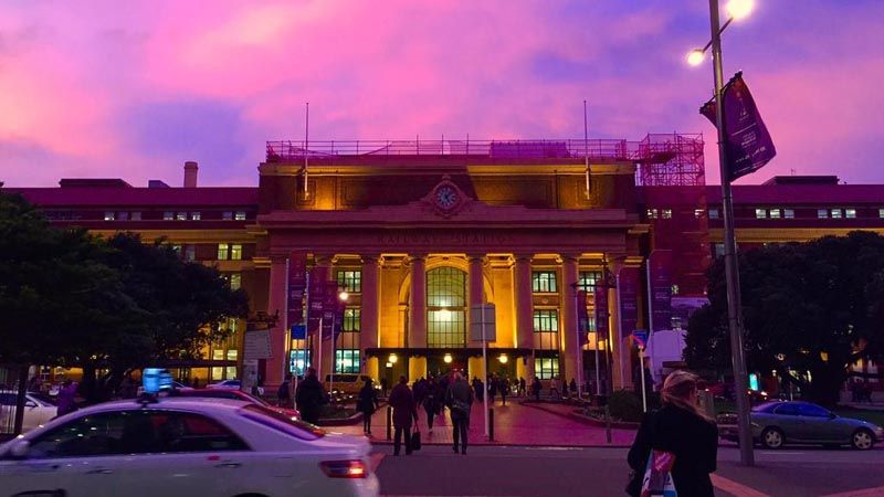 The Wellington sky above the Railway Station glows pink.
