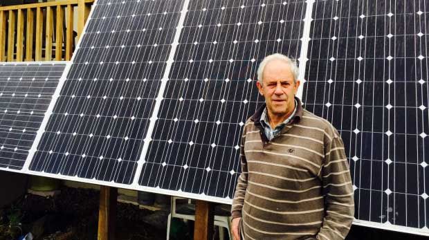 Les Gibbs stands in front of his solar panels. — Georgia Weaver/Fairfax NZ.