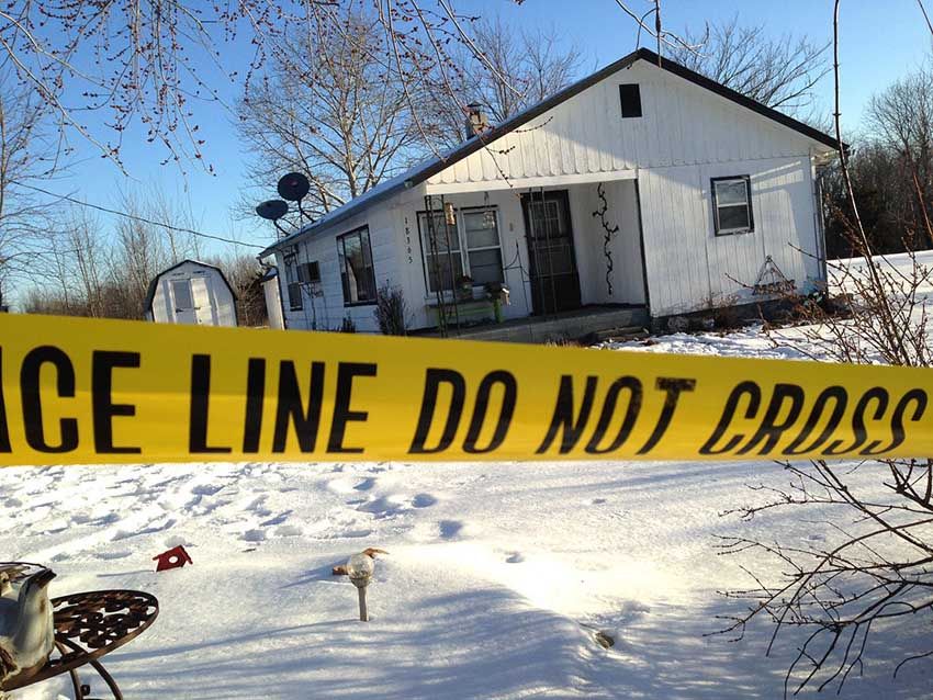 Police tape surrounds one of the crime scenes in Tyrone, Missouri, on Friday, February 27th, 2015. Authorities say multiple people were shot to death and one was wounded in attacks at several homes. The suspected gunman was found dead from an apparent self-inflicted gunshot wound. — Photo: Jeff McNiell/Houston Herald/Associated Press.