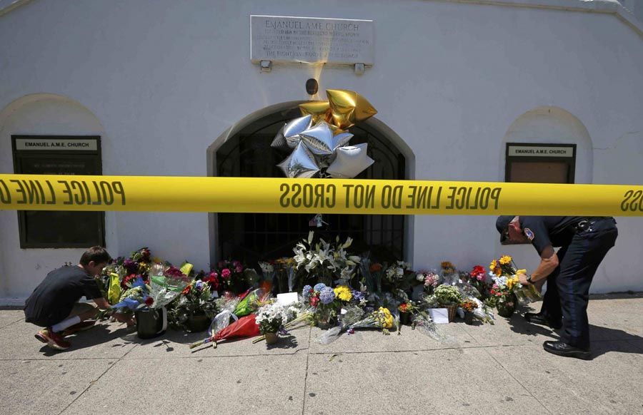 Flowers left outside Emanuel African Methodist Episcopal Church in Charleston, South Carolina, after Wednesday’s mass shooting. — Photo: Brian Snyder/Reuters.