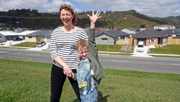 Riverside Gardens Neighbourhood Support group co-ordinator Christina Gillmore with her son, Connor Gillmore, outside the subdivision in Pomare, Lower Hutt.  Photograph: Jared Nicoll/Fairfax NZ.