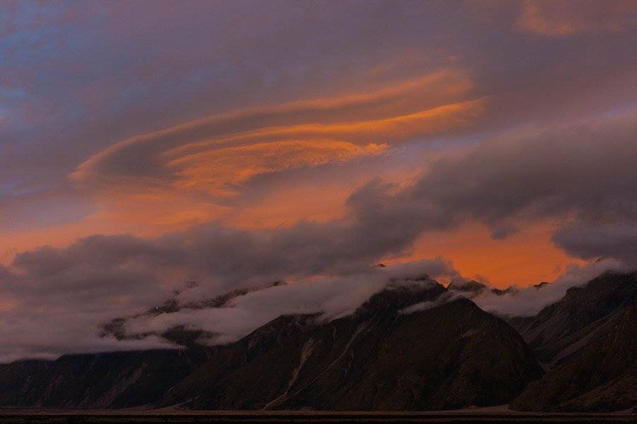 The weather provides photographer Simon Middlemass with a palette of light and colour to capture stunning photos of clouds over the mountains.