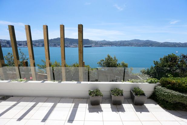 The notorious view-blocking Roseneath fence, in the process of being removed to reveal the view, after a $500,000 court battle.  Photo: Cameron Burnell/Fairfax NZ.