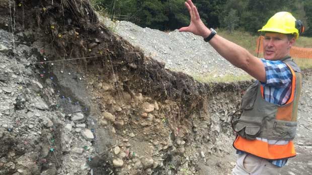 GNS Science earthquake geologist Robert Langridge studying layers in the trench across the Alpine Fault at Springs Junction. New research has found that the fault line may be the world's fastest-moving, having shifted around 700km in 25 million years.  Photo: Joanne Carroll/Fairfax NZ.