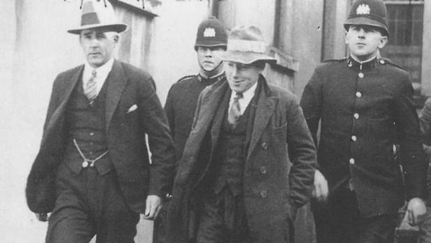 George Coats, centre, flanked by police, was one of four men hanged at Mt Crawford jail.
