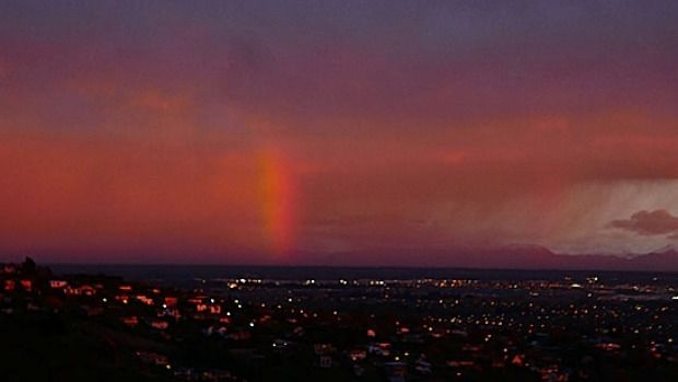 Sunrise over Christchurch on Wednesday with a vertical rainbow over Mount Hutt skifield.  Photograph: Tim McGinn.