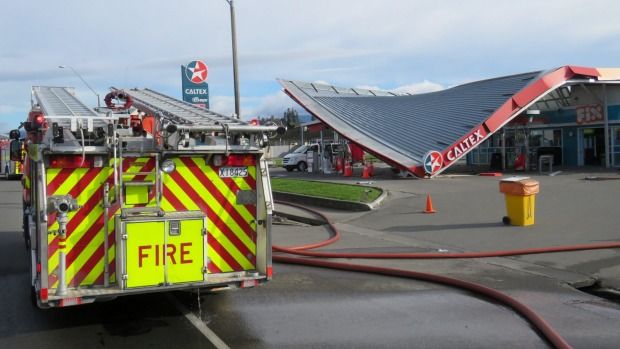 Several fire engines attended the crash. No fuel was spilt when the petrol bowser was knocked over.  Photograph: Piers Fuller/Fairfax NZ.