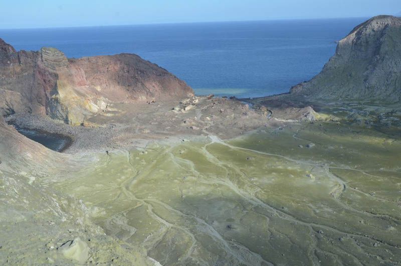 Our scientists took a flight out to White Island (Whaakari) to get more info on the eruption. Green stuff is ash.  Photo: GeoNet/Twitter.