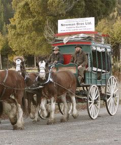SLOW COACH: Lester Rowntree, left, and Hone Ma Heke re-enacting the first coach trip with a replica Cobb and Co stagecoach and clydesdale horses after setting up near the Wai-iti River along State Highway 6 towards Murchison. — MARION VAN DIJK/The Nelson Mail.