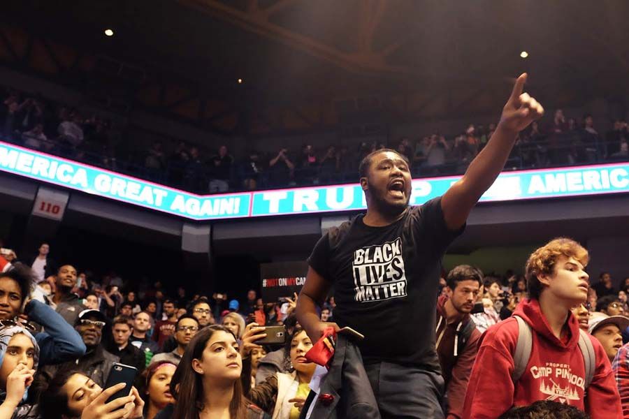 Protesters rally during a Donald Trump campaign stop inside the UIC Pavilion. — Photograph: Chris Sweda/Chicago Tribune.