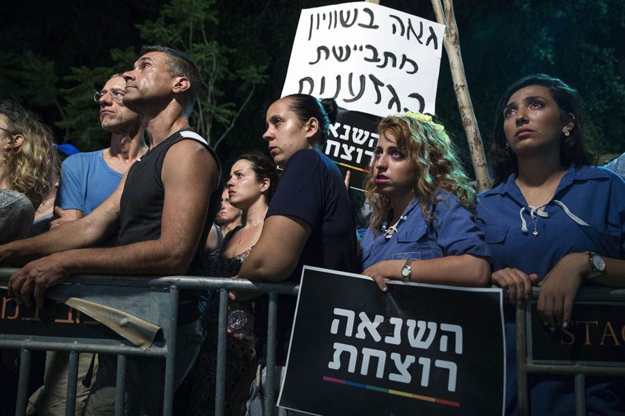Israelis take part in a rally August 1st, 2015 in Tel Aviv's Meir Square in solidarity with the victims of an attack on six participants of a gay pride march in Jerusalem a few days earlier.  Photo: Jack Guez/AFP/Getty Images.