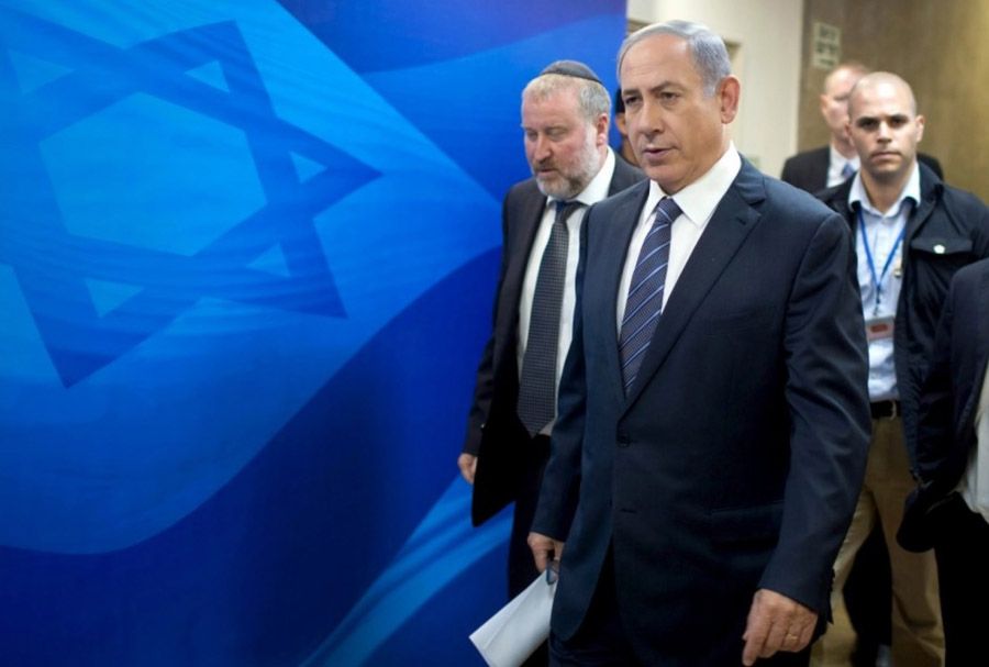 Israeli Prime Minister Benjamin Netanyahu, right, and Cabinet Secretary Avichai Mandelblit arrive at the weekly cabinet meeting in Jerusalem on Sunday. Netanyahu said Israel could not afford to take in refugees fleeing the war in neighboring Syria and vowed to surround Israel with security fences on all its borders.  Photograph: Menahem Kahana/Reuters.