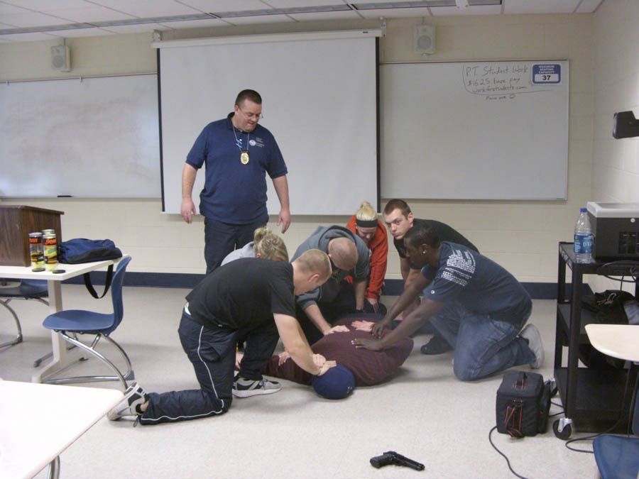 Students at the University of Toledo learn to confront an active shooter and other survival techniques during a training session by the ALICE Institute.  Photograph: University of Toledo Police Department.