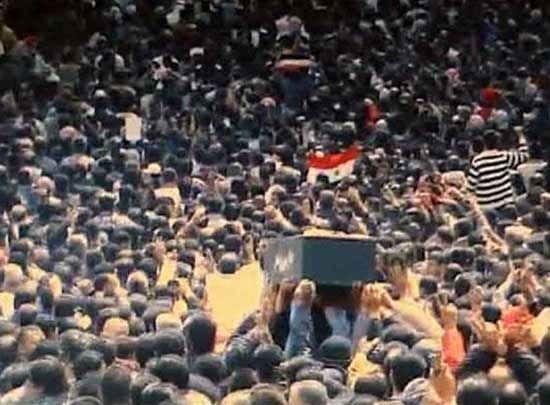 This image from a video shot in March 2011 shows crowds of mourners carrying a coffin during funerals of protesters killed in earlier clashes in Daraa, Syria. — Photograph: Reuters.